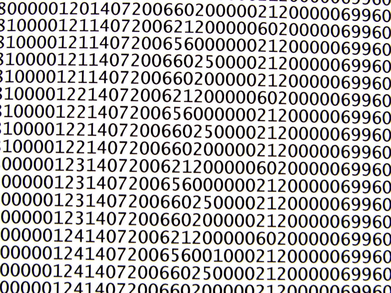 database concept with printed and coded database records photo