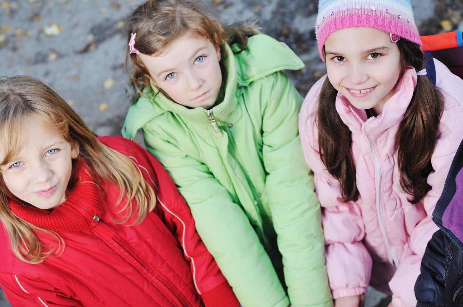 friendship and teamwork concept with young schoolgirls group photo