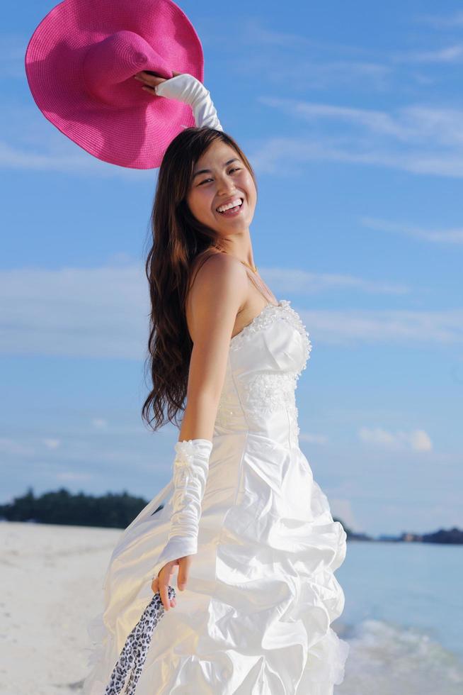 asian bride on beach photo