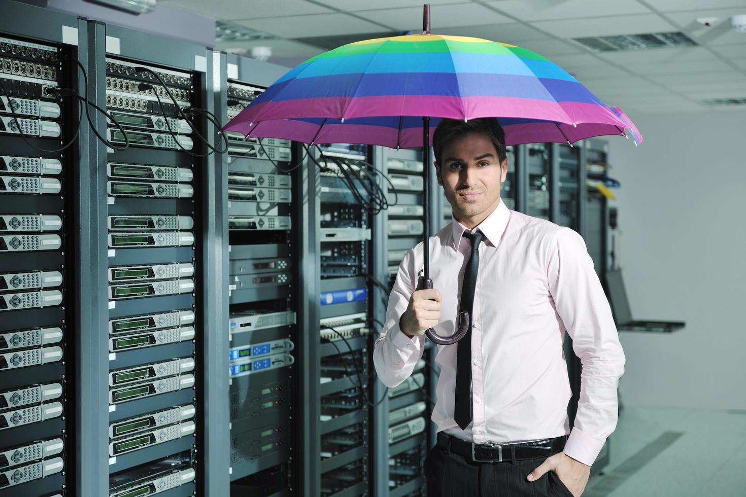 businessman hold umbrella in server room 11919977 Stock Photo at Vecteezy