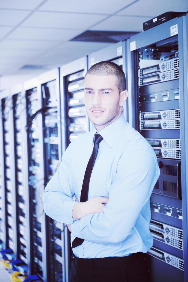 young it engeneer in datacenter server room photo