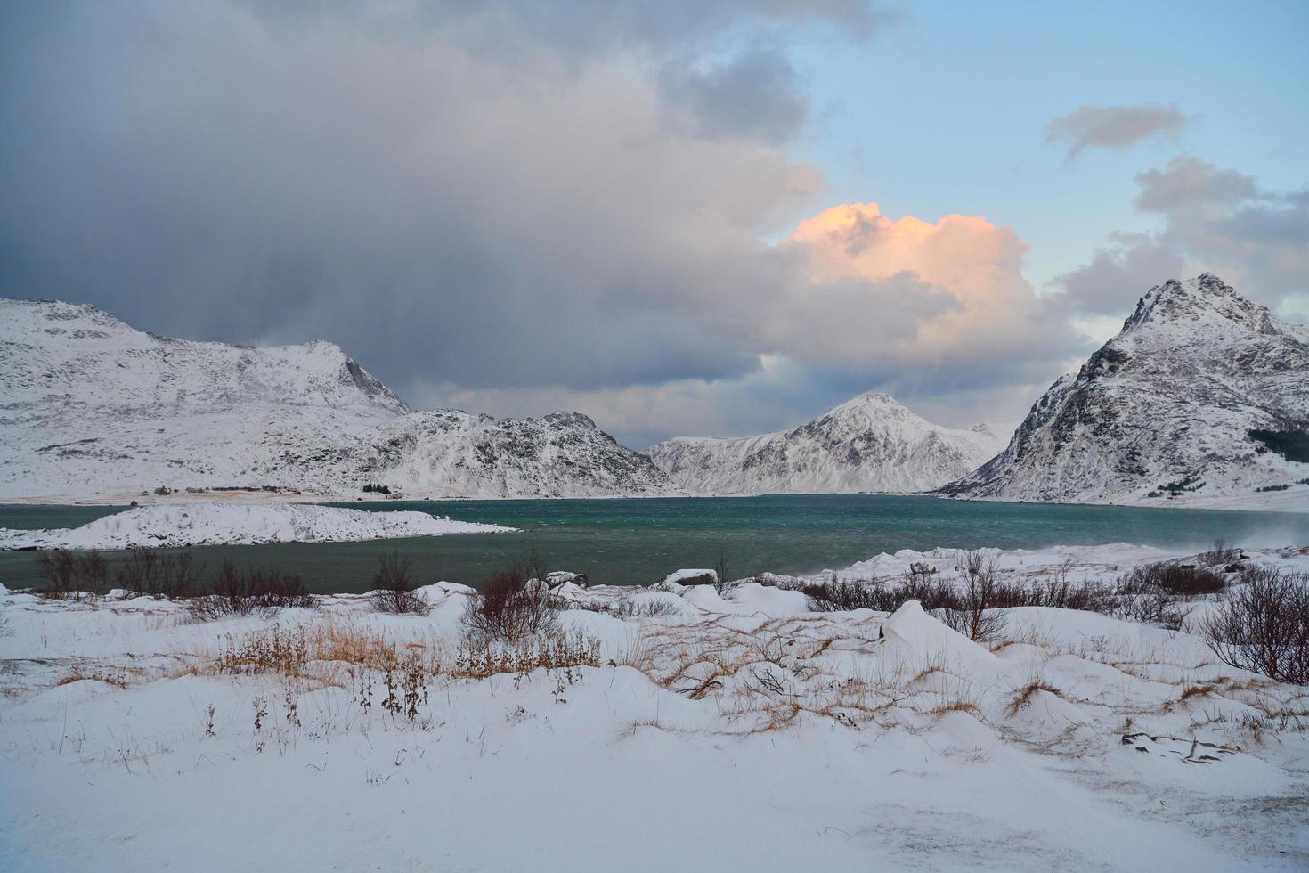 norway coast in winter with snow bad cloudy weather photo