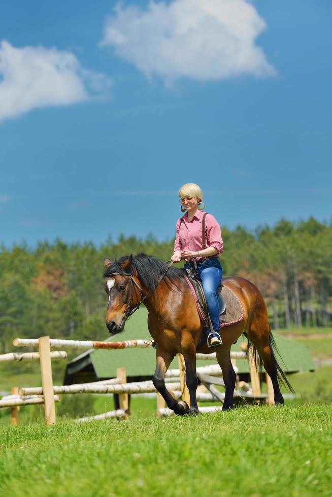 happy woman  on  horse photo