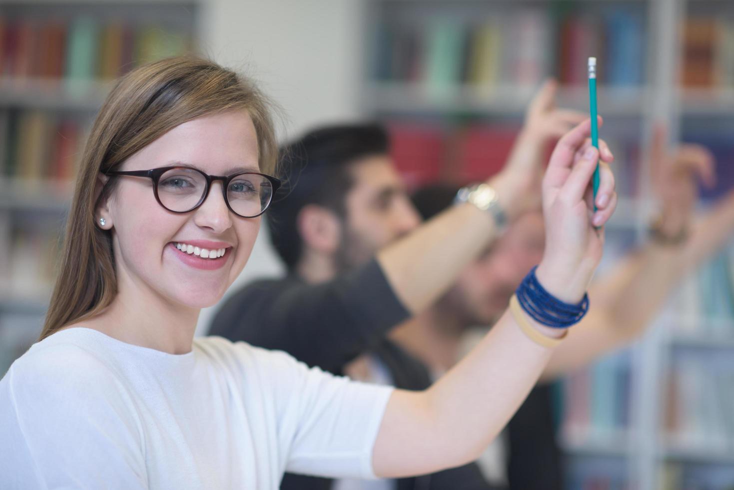 group of students  raise hands up photo