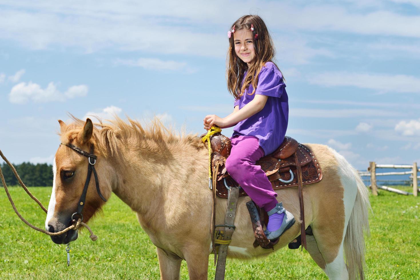 child ride pony photo