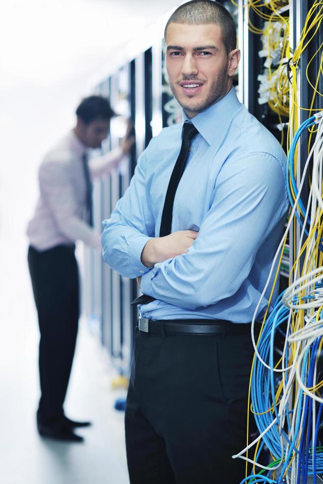 it engineers in network server room photo