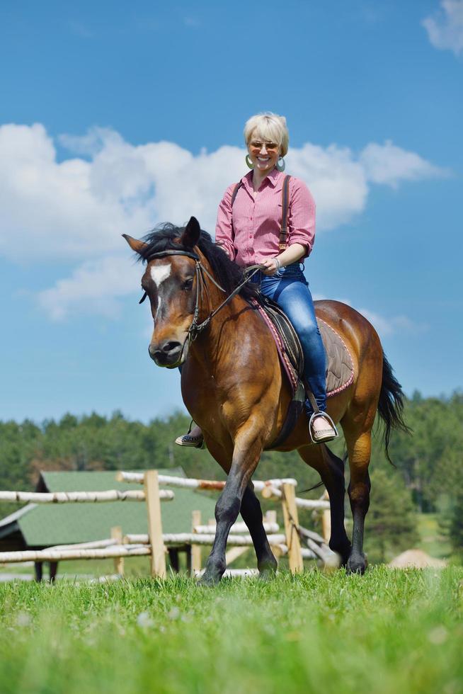 happy woman  on  horse photo