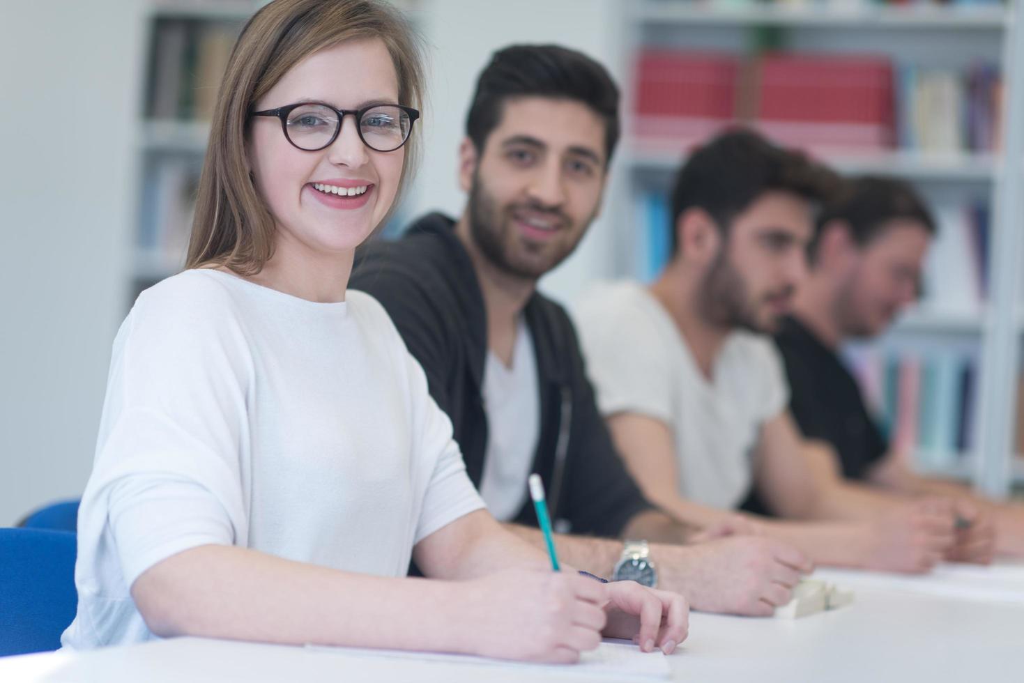 group of students study together in classroom photo