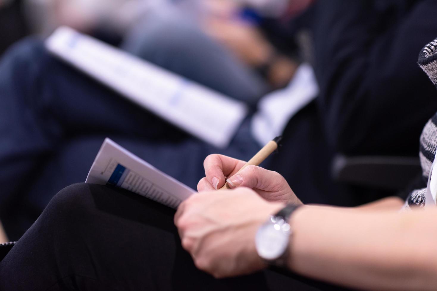 business people taking notes photo