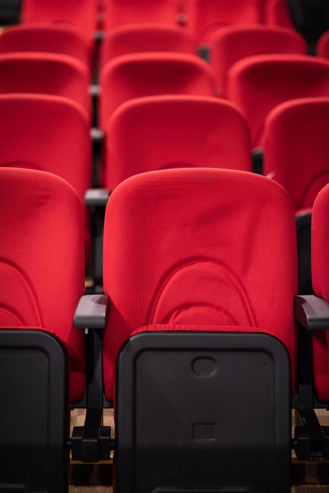 hall with rows of red seats photo