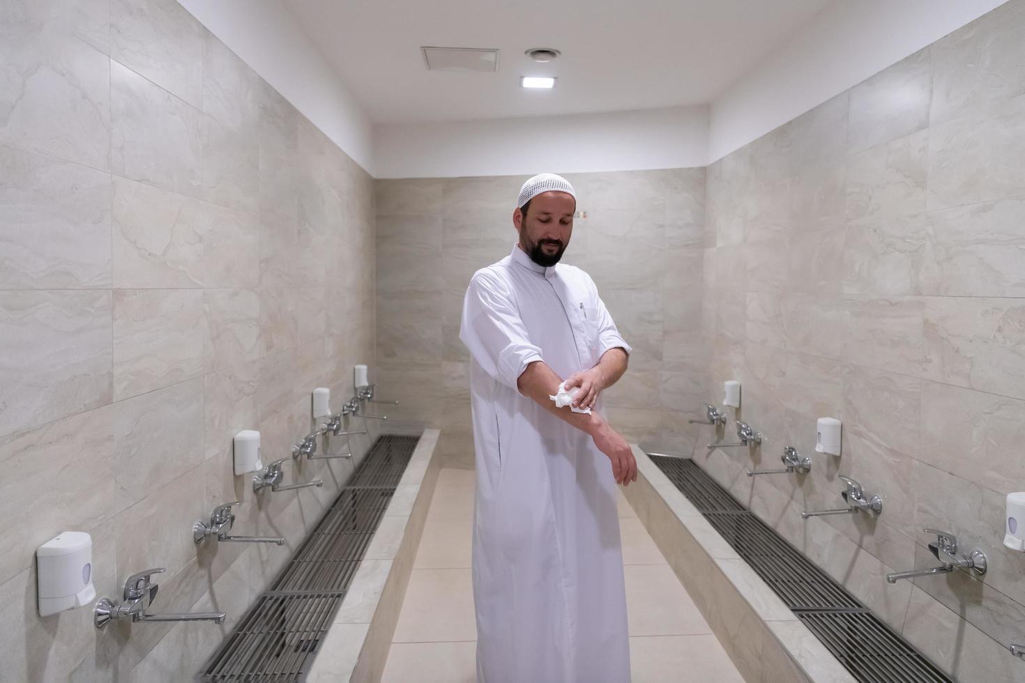 a portrait of a man in abdesthana using a towel photo