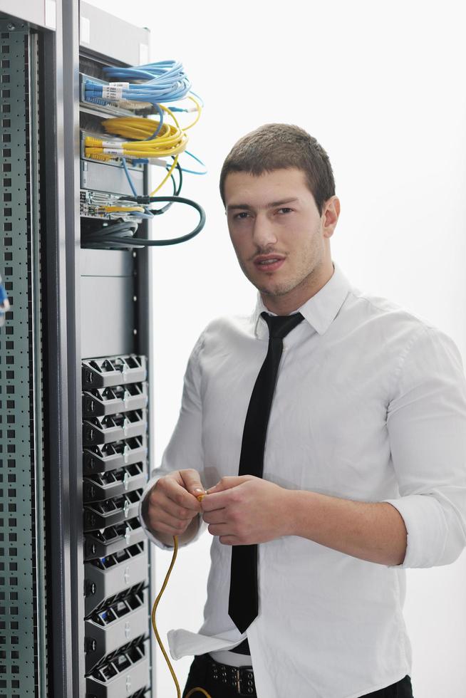 young it engeneer in datacenter server room photo