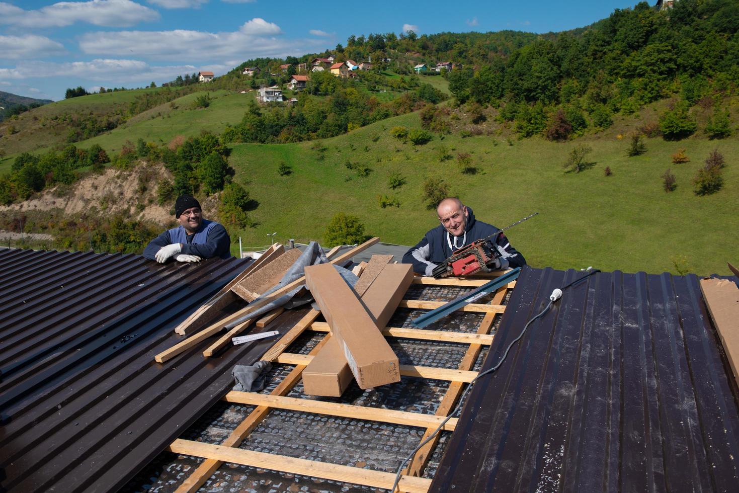Construction worker installing a new roof photo