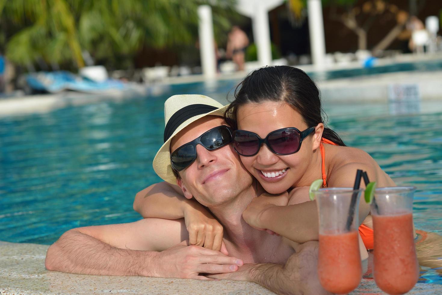 happy young couple have fun on beach photo