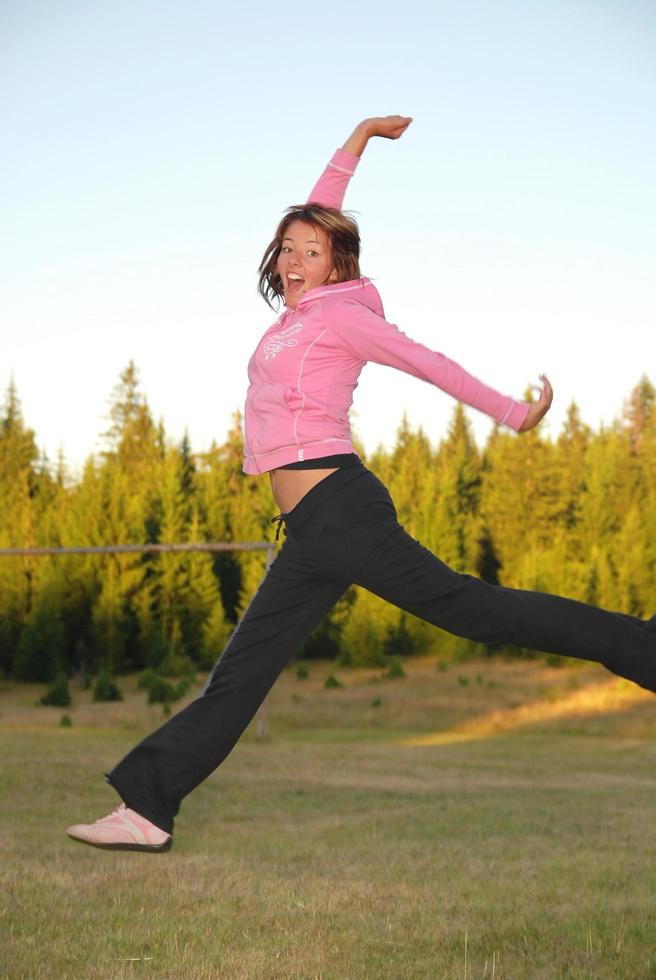 pretty girl jumping in a air photo