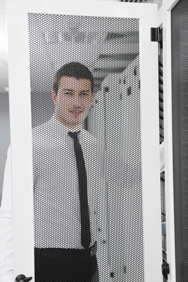young it engeneer in datacenter server room photo