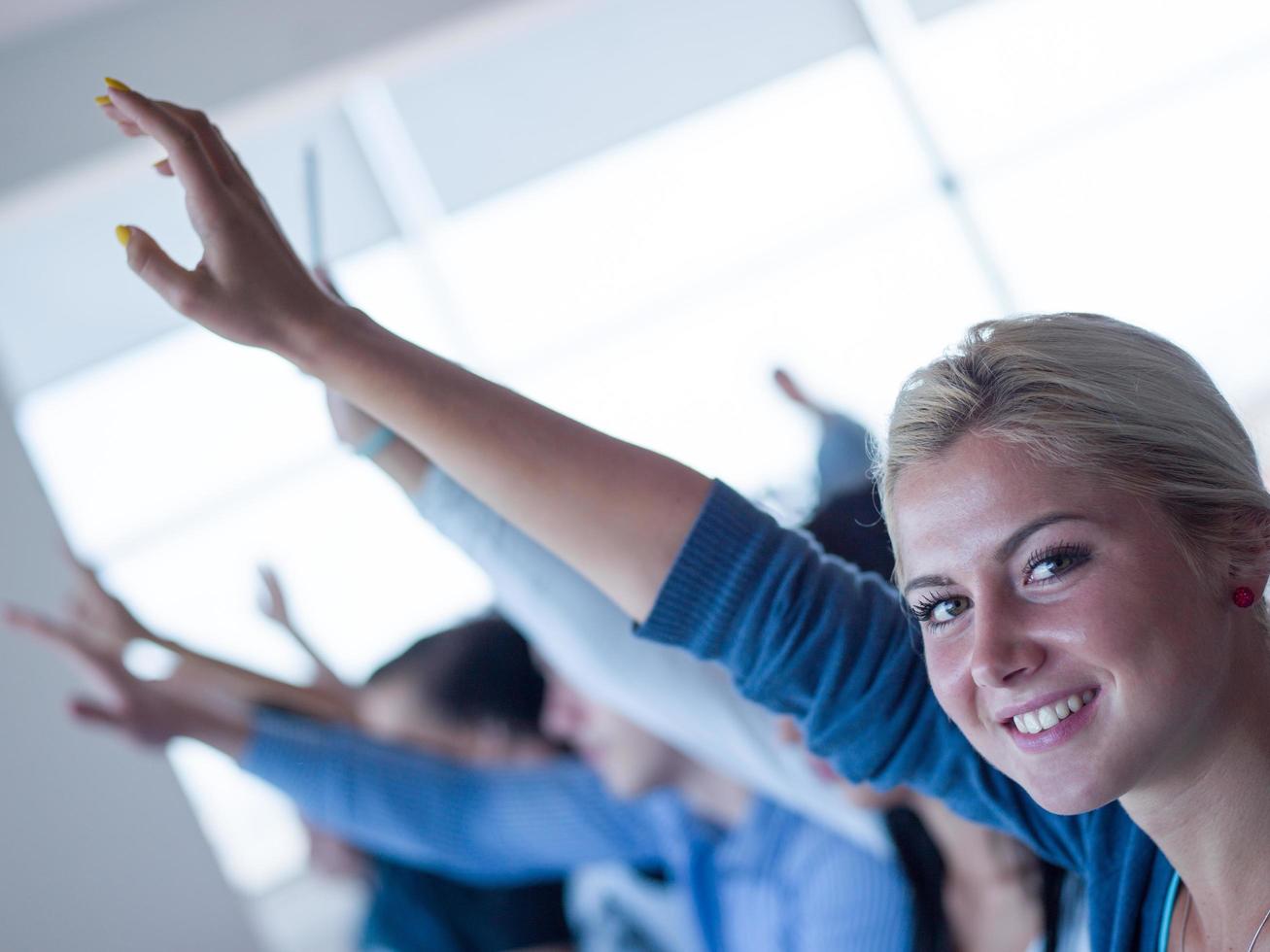 students group raise hands up photo