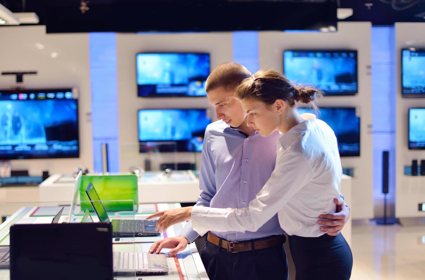 People in electronics store photo