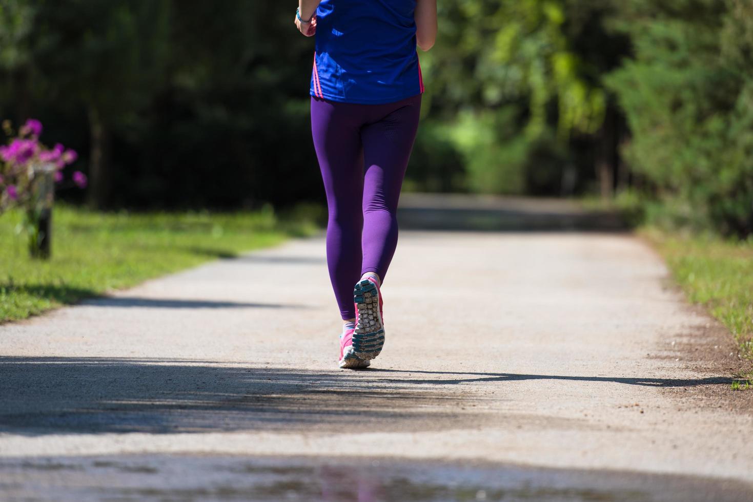 young female runner training for marathon photo
