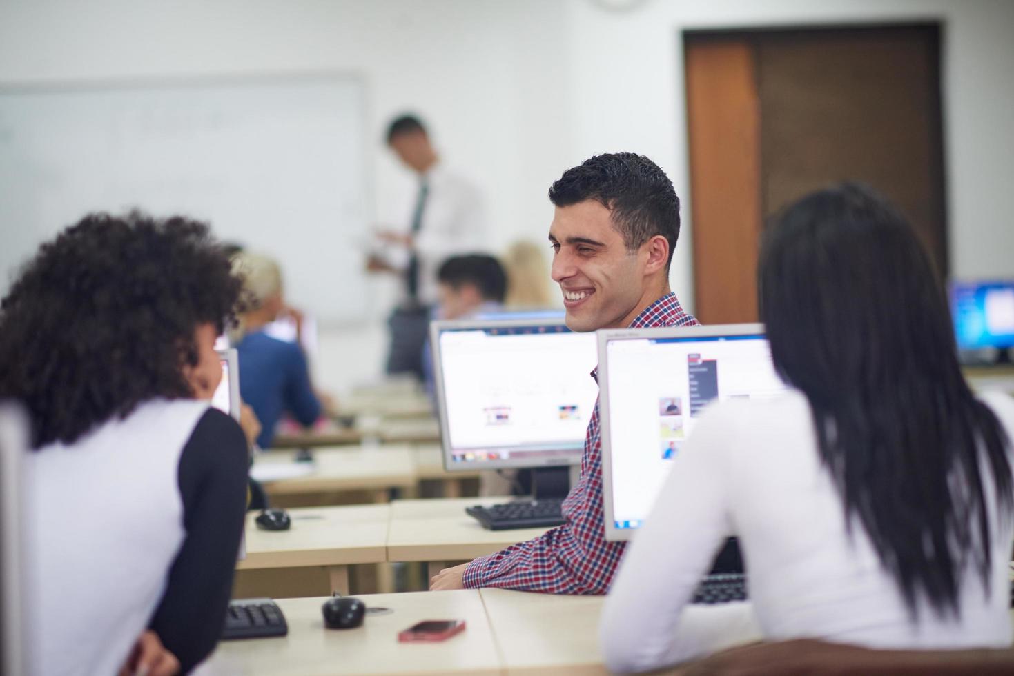students group in computer lab classroom photo