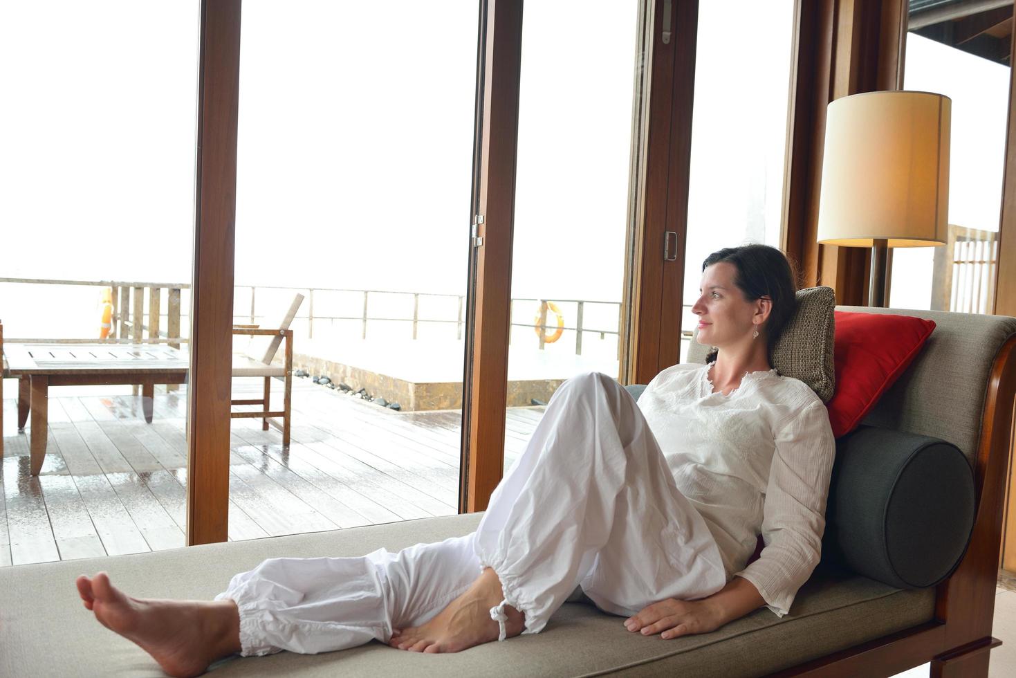 happy young woman relax at home on sofa photo