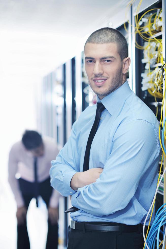 it engineers in network server room photo