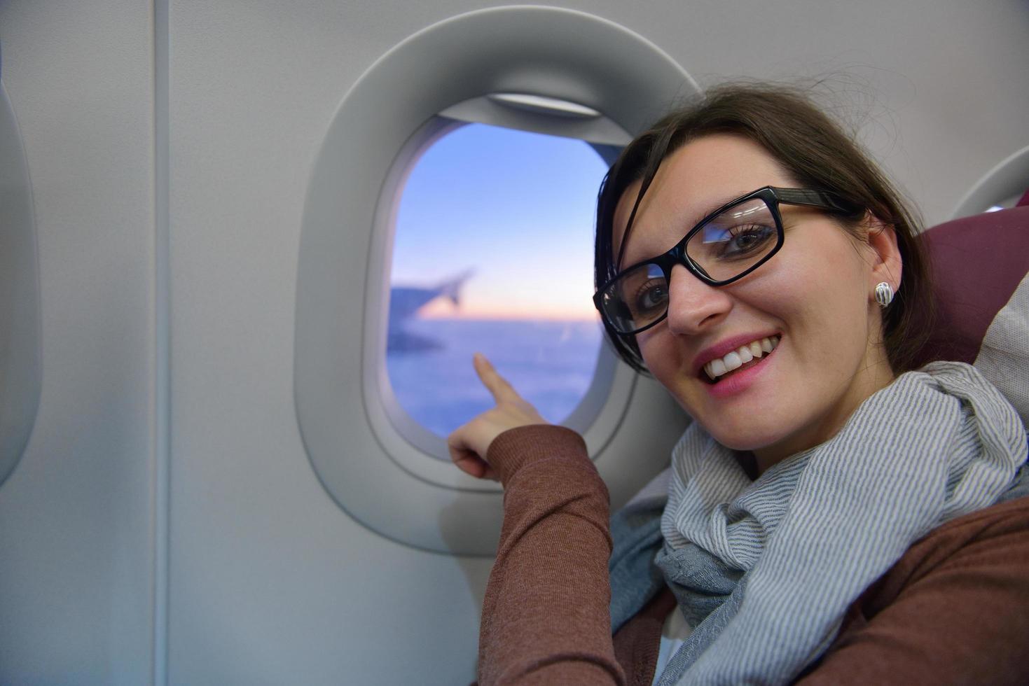 woman in airplane travel photo