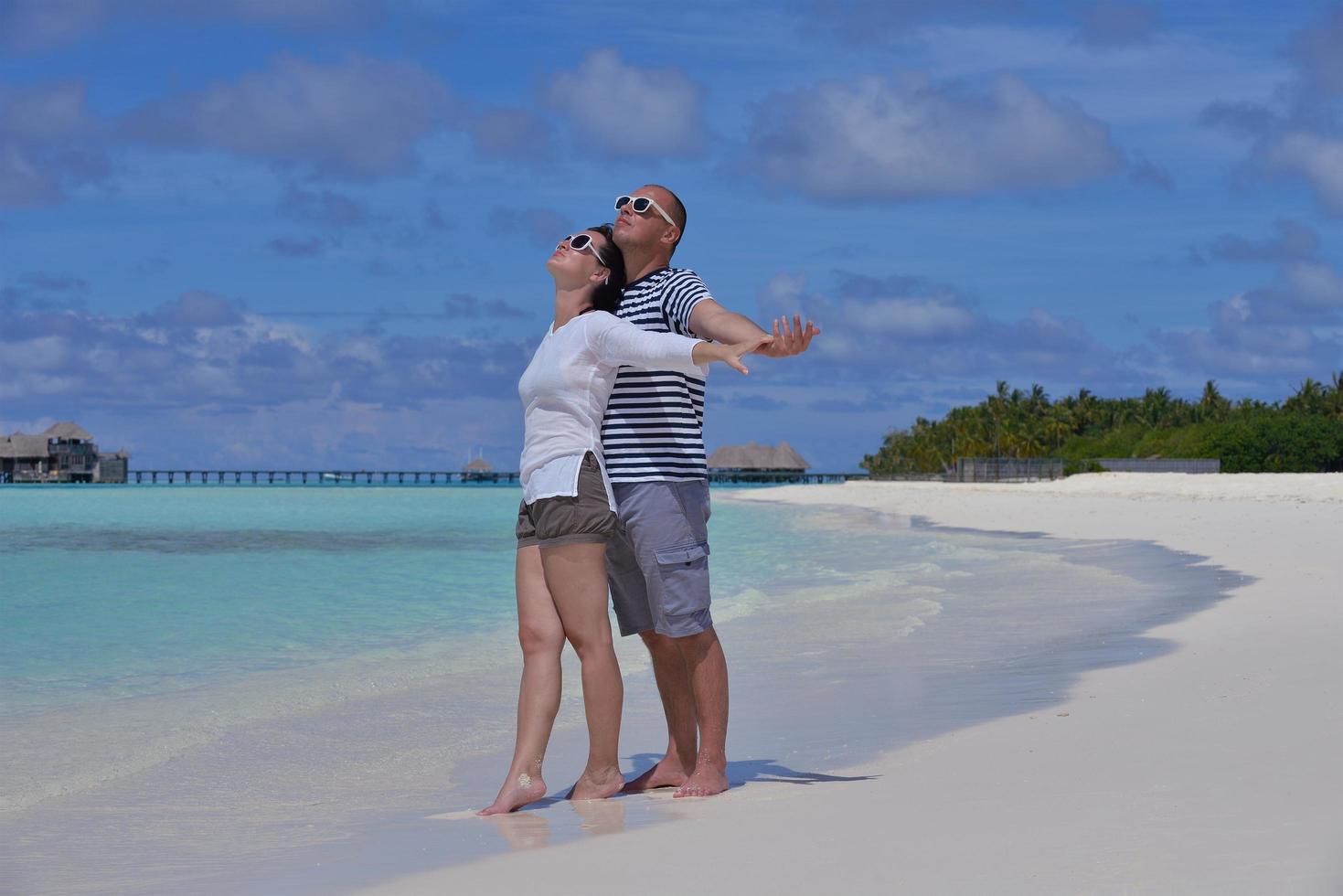 happy young  couple at summer vacation have fun and relax at beach photo
