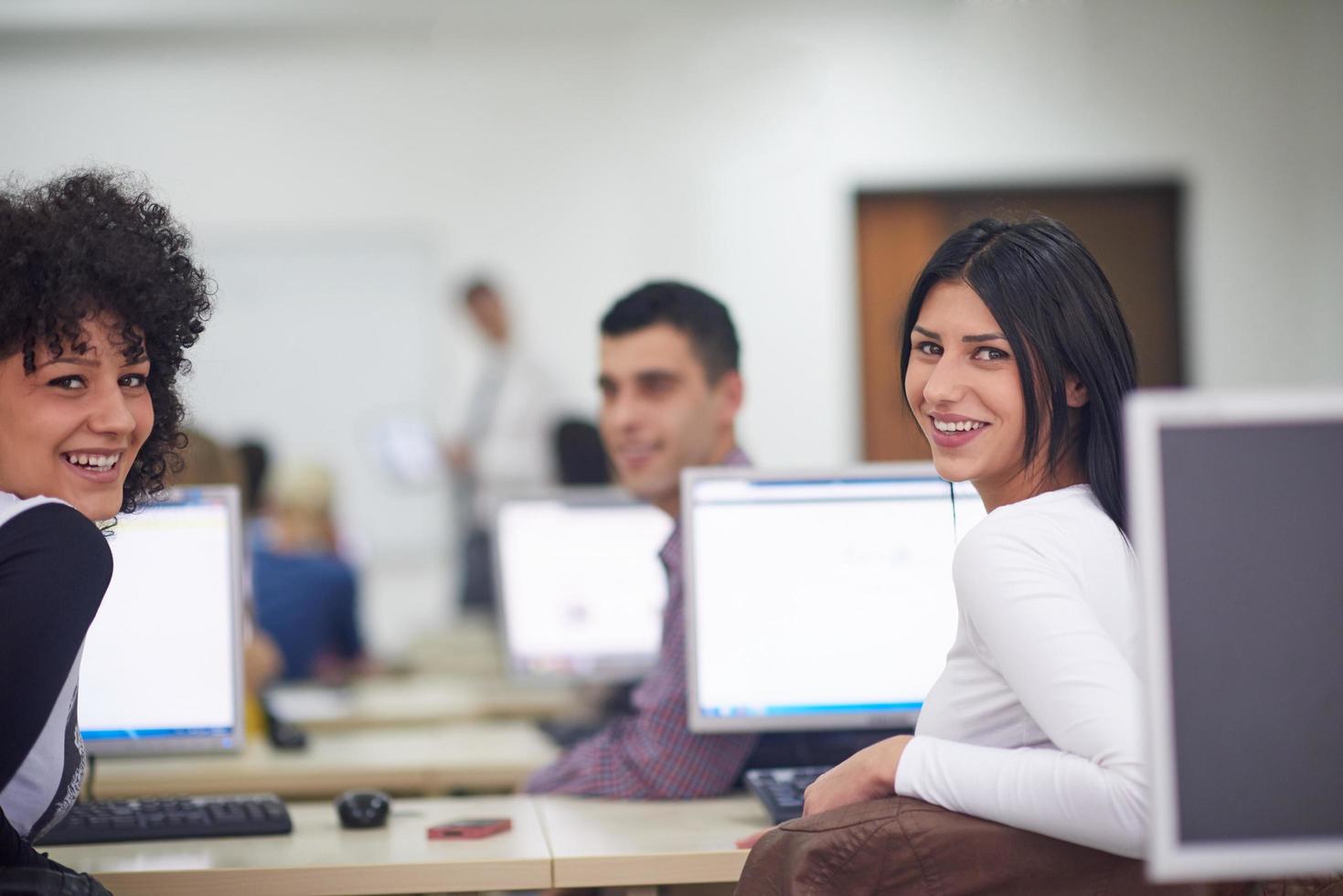 students group in computer lab classroom photo
