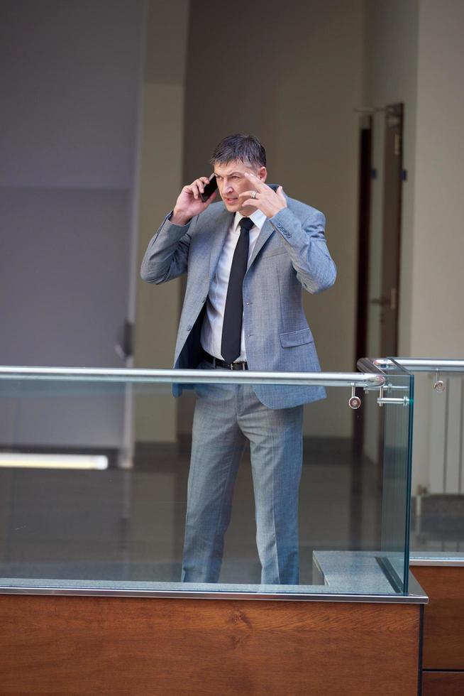 business man using phone photo