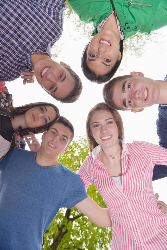 young friends staying together outdoor in the park photo