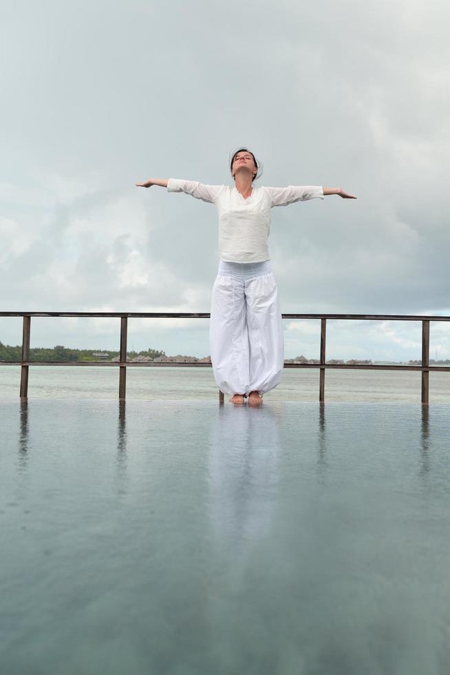 young woman relax on cloudy summer day photo