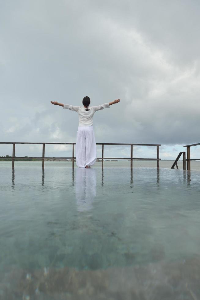 young woman relax on cloudy summer day photo