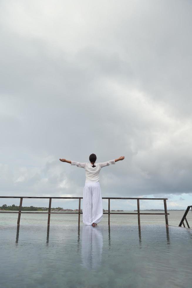 young woman relax on cloudy summer day photo