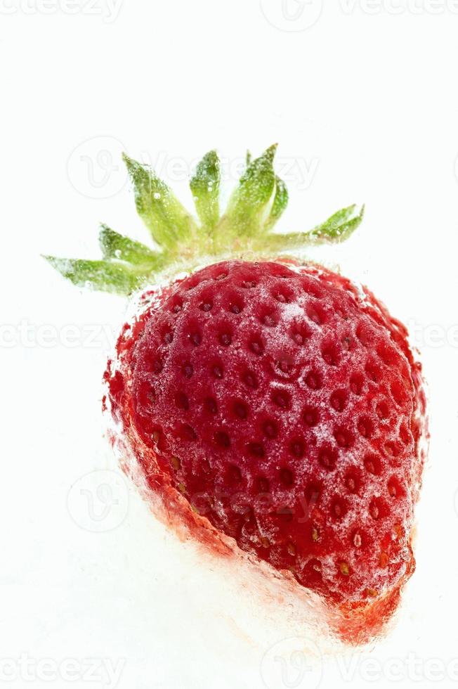 Frozen strawberry in closeup photo