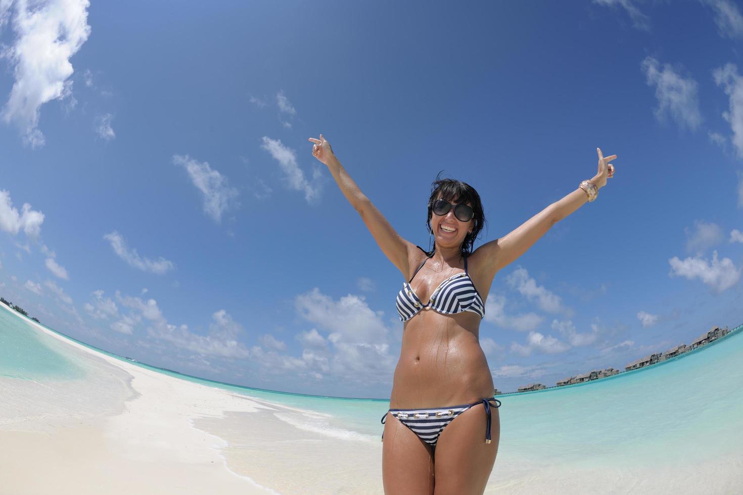 beautiful young woman  on beach have fun and relax photo