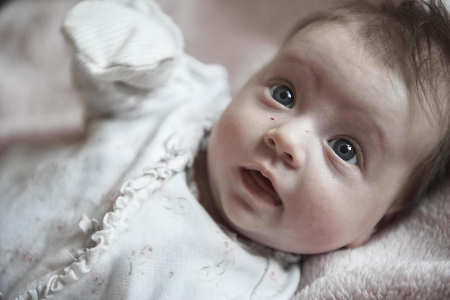 happy newborn little baby smilling photo