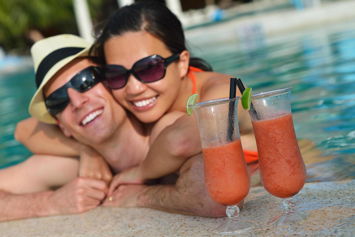 happy young couple have fun on beach photo