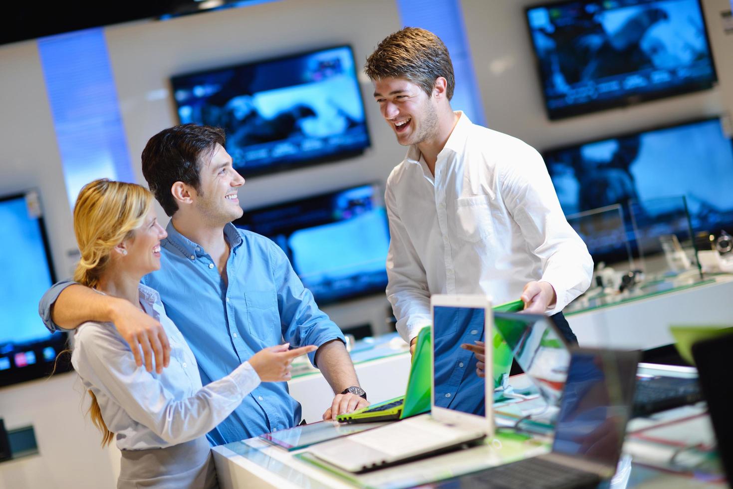 People in electronics store photo