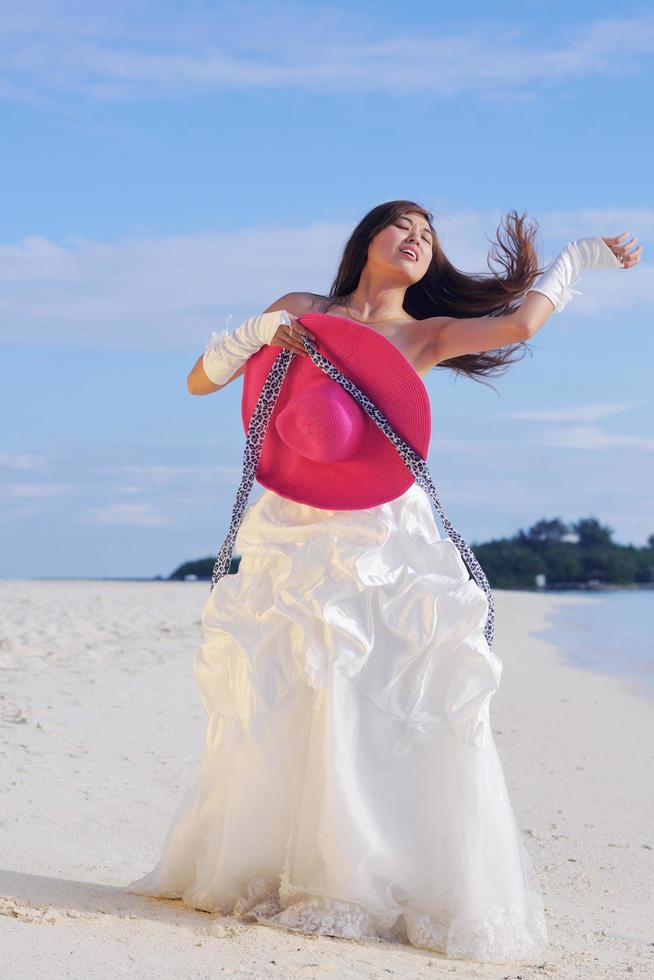 asian bride on beach photo