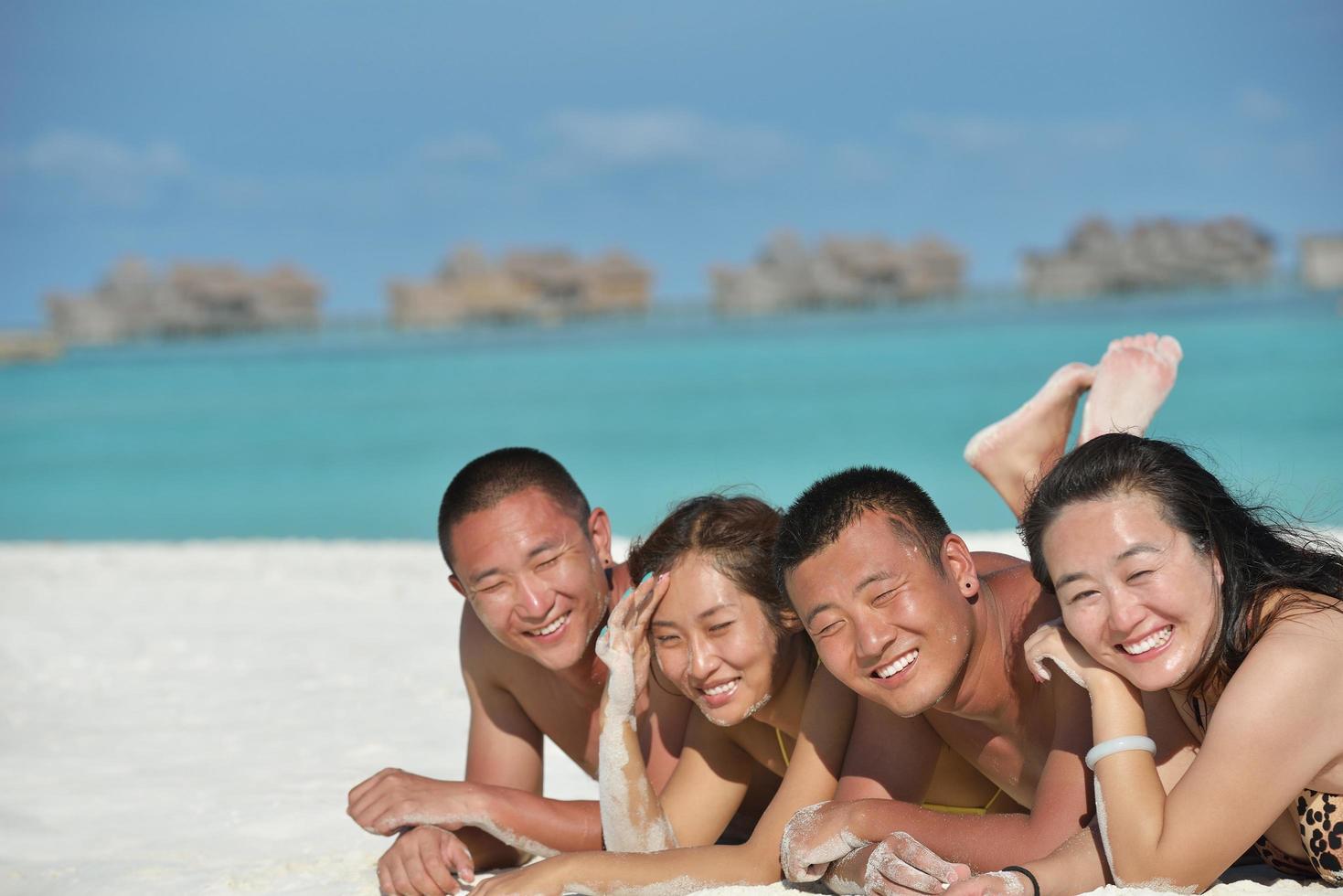 group of happy young people have fun on bach photo