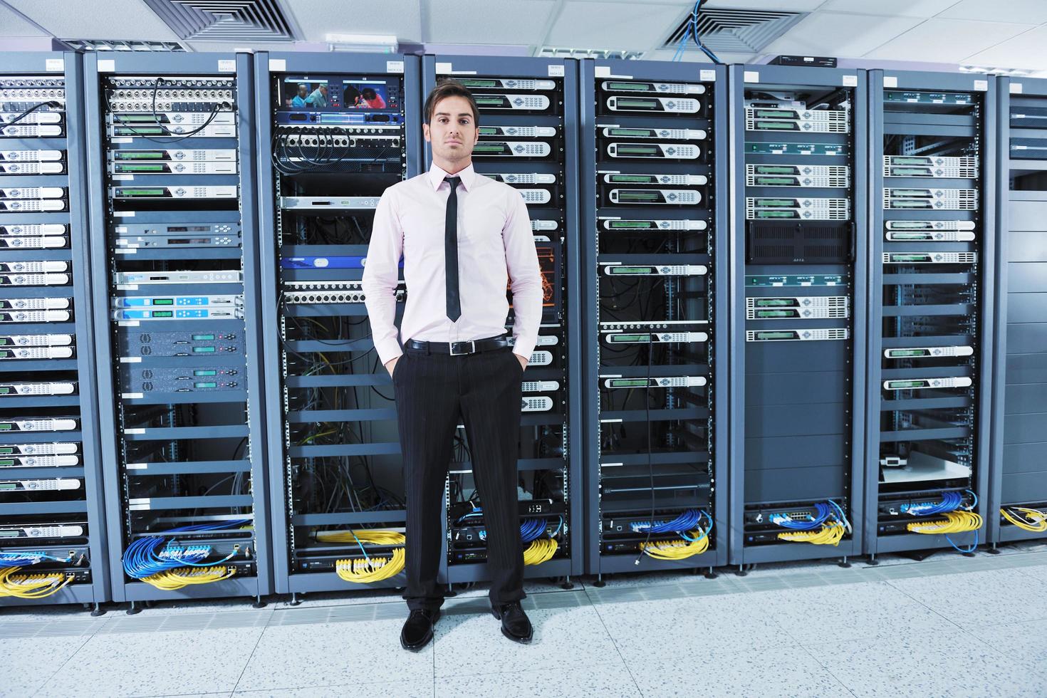 young it engeneer in datacenter server room photo