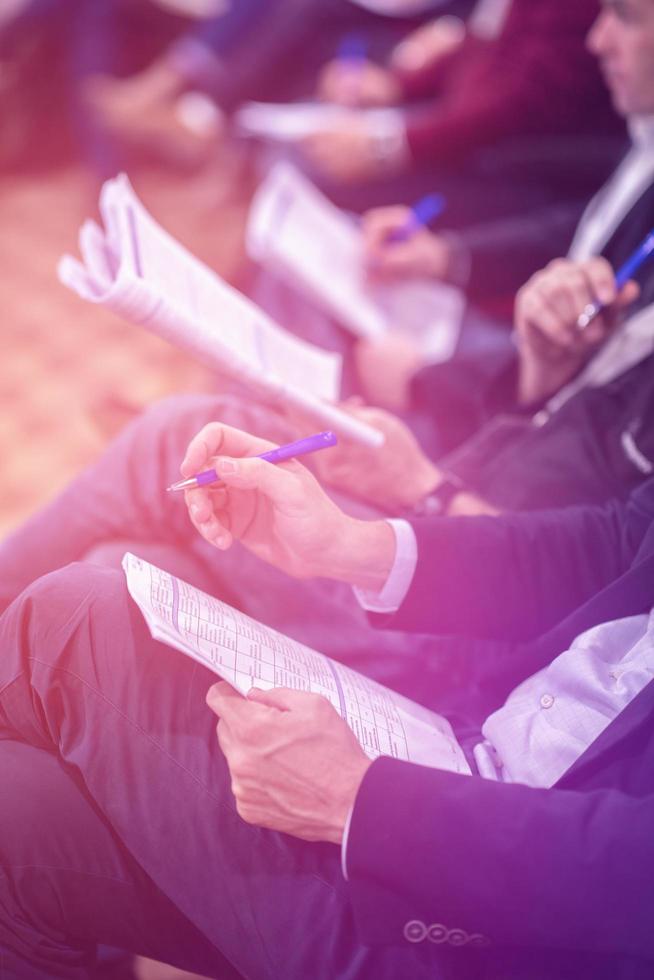 business people taking notes photo