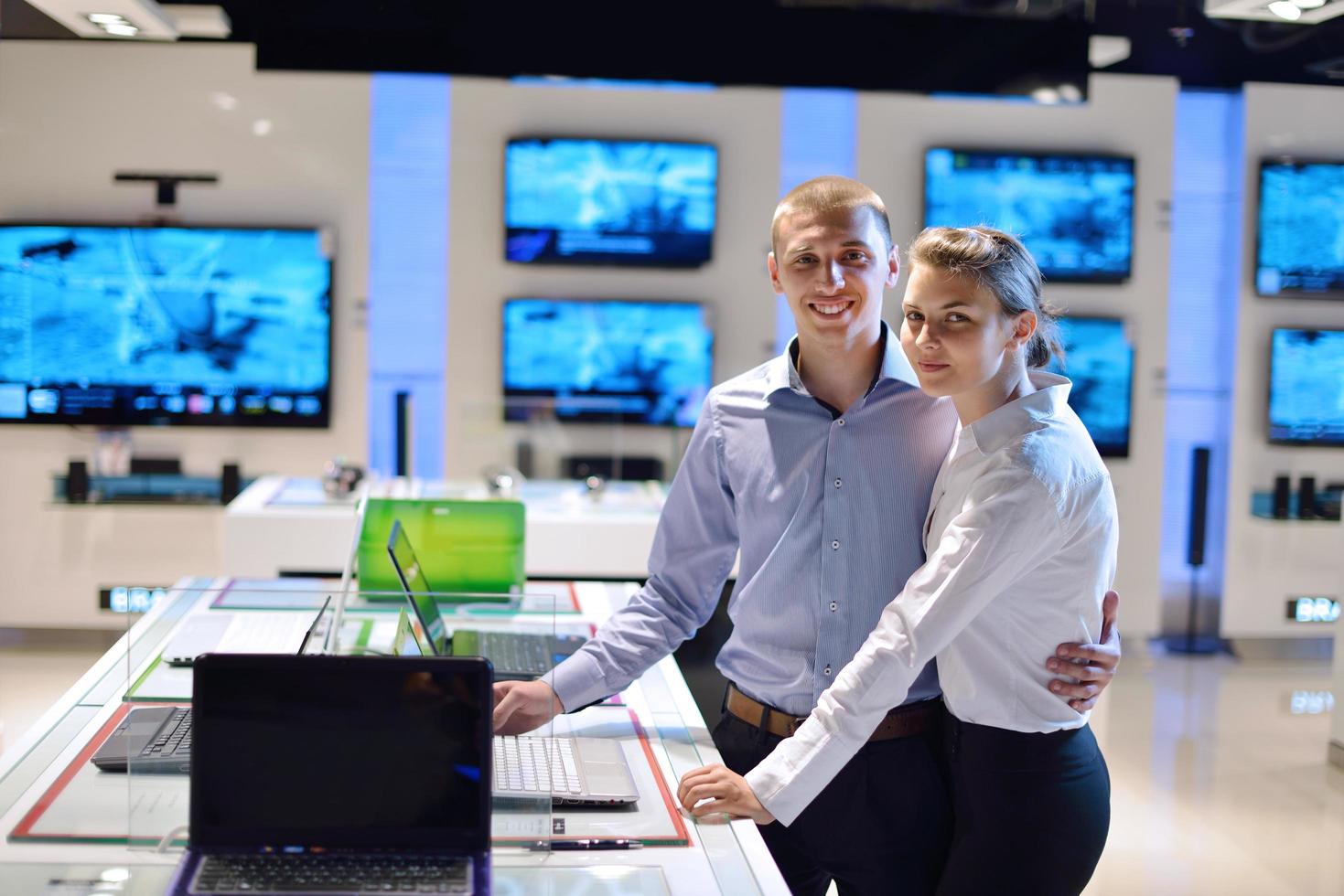 People in electronics store photo