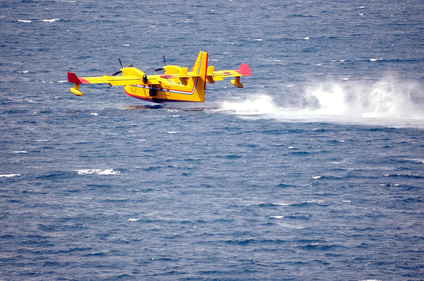 Sweden, 2022 - Airplane on sea taking water photo