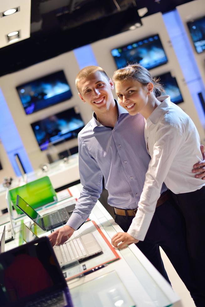 People in electronics store photo