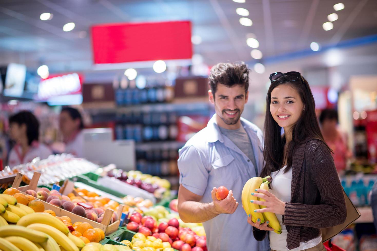 couple shopping in a supermarket photo