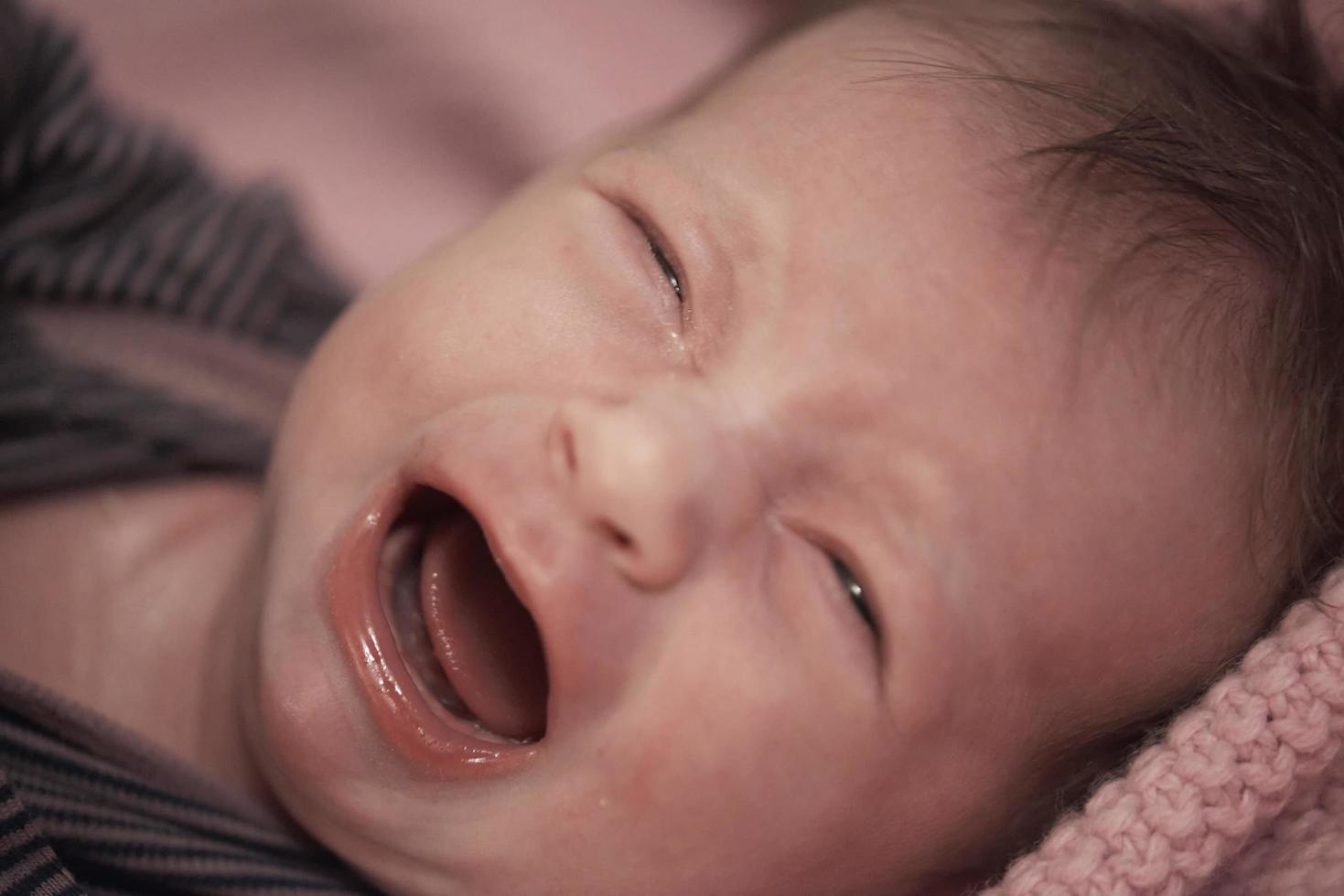 newborn baby crying and screaming photo