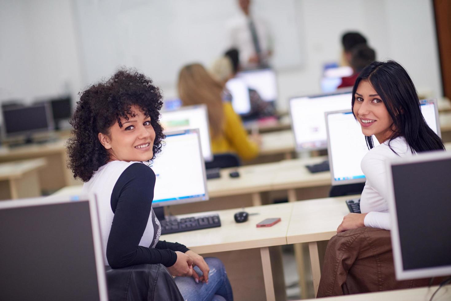 students group in computer lab classroom photo