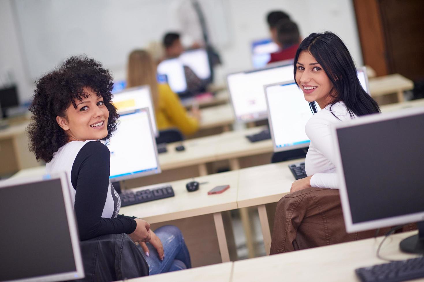 students group in computer lab classroom photo
